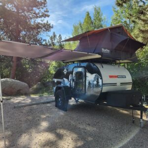 Camper trailer parked in scenic wilderness
